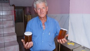 75 teneke kovandan 2 ton bal çıkardı